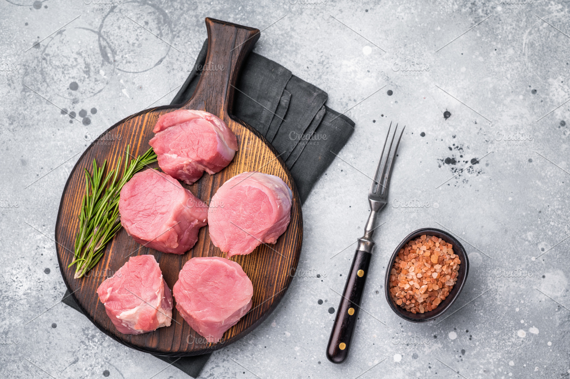Beautifully cut raw pork medallions for tenderloin meat, waiting, a Food & Drink Photo by composter-box@mail.ru
