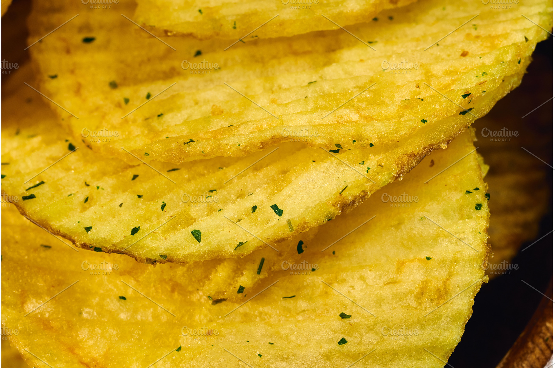 Golden potato chips are layered, a Food & Drink Photo by darksoul72