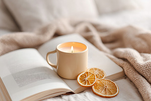 Cozy indoor flat lay with a ceramic mug candle and dried orange slices on a bla, a Food & Drink Photo by AlyaAnd