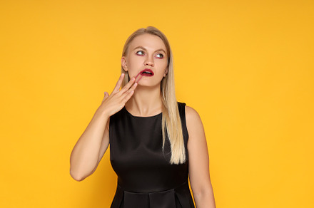 Concept of Halloween, young woman on yellow background, a Person Photo by AtlasStudio PRO