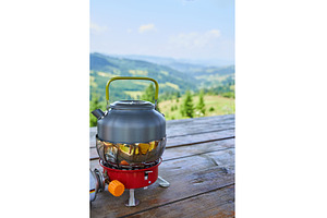Enjoying a kettle on a camping stove, an Animal Photo by IlliaBondarPhotography
