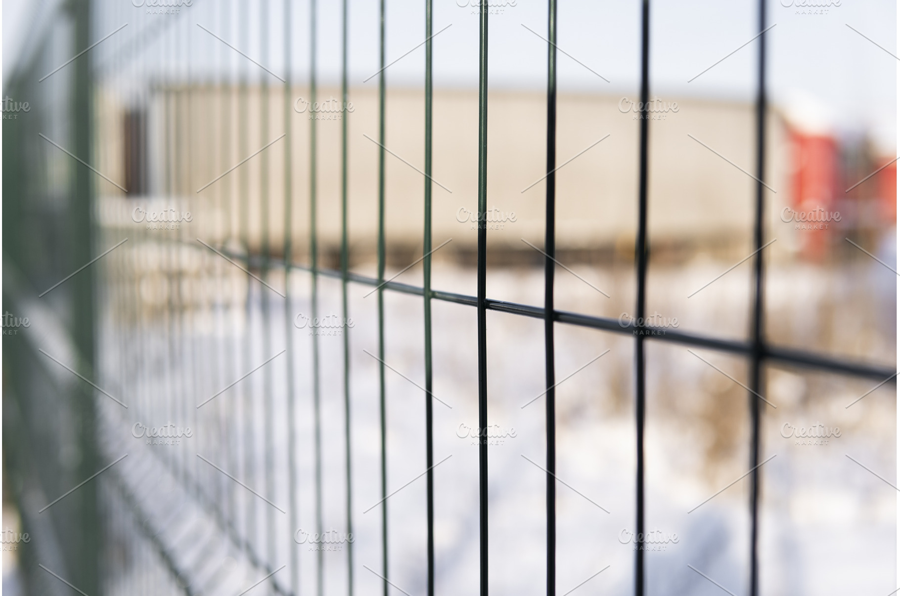 Industrial metal fence with blurred, an Industrial Photo by volodymyrshtun13795