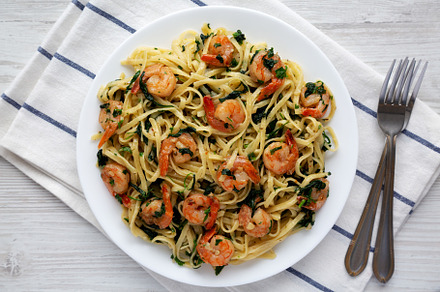 Homemade One-Pot Lemon Garlic Shrimp Pasta on a Plate on a white, a Food & Drink Photo by LiudmylaChuhunova