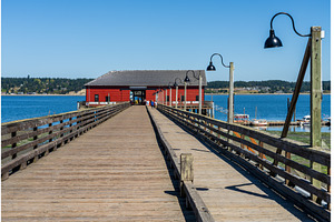 Wooden pier leading to famous red, an Architecture Photo by Backyard Stock