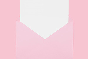 Blank empty white paper card in pink opened envelope isolated on pink backgroun, an Abstract Photo by Lenor4ik