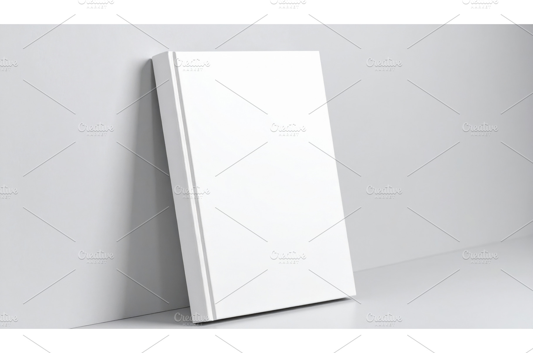 A blank white book cover leaning on, a Background Photo by Igor Tichonow