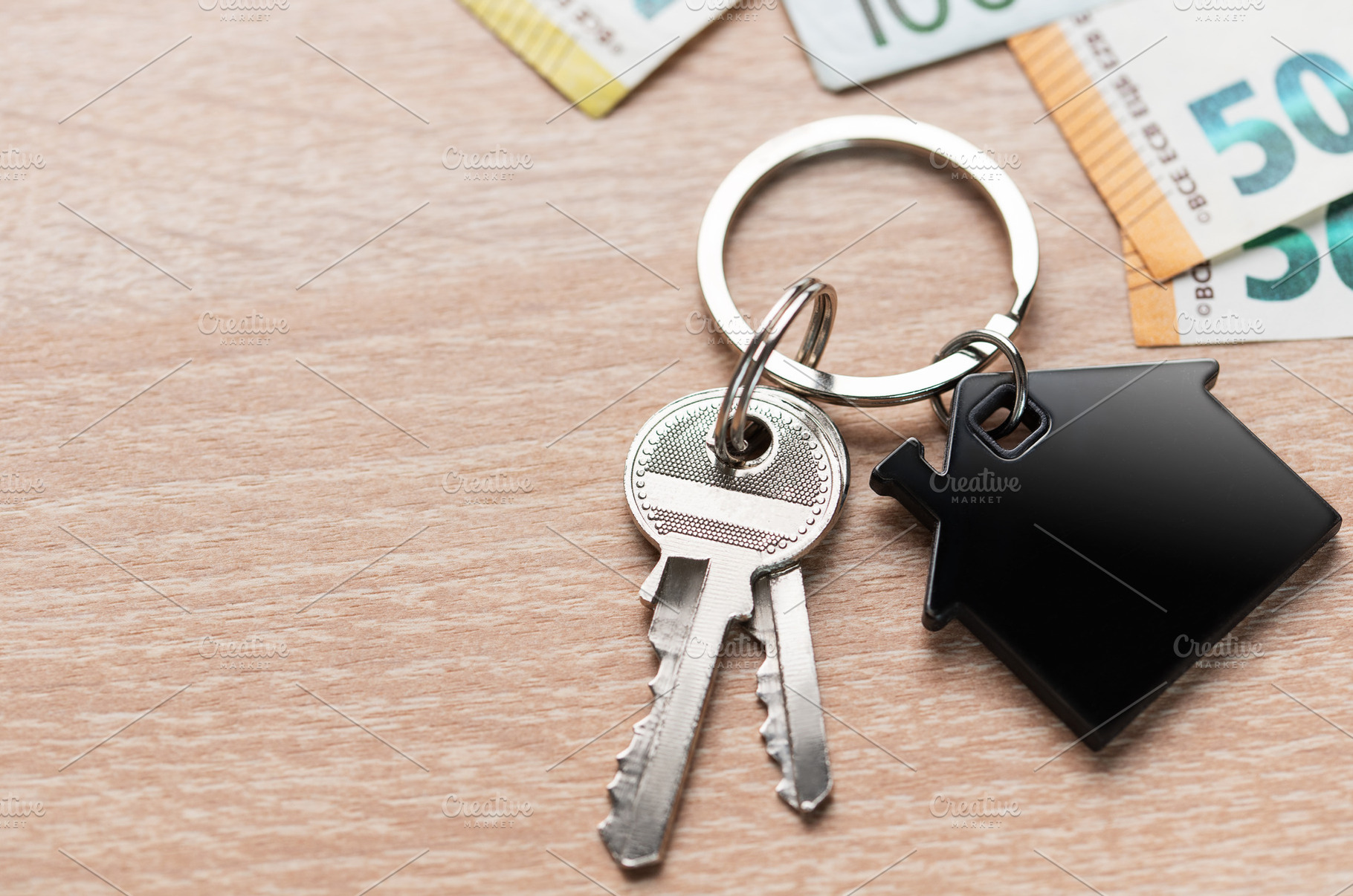 House keys with home shape keyring and euro currency, a Business Photo by Olena Rudo