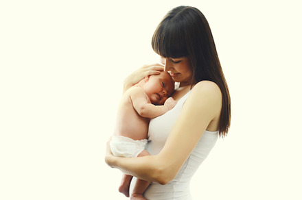 Happy mother holding cute infant, ba, a Person Photo by Rohappy
