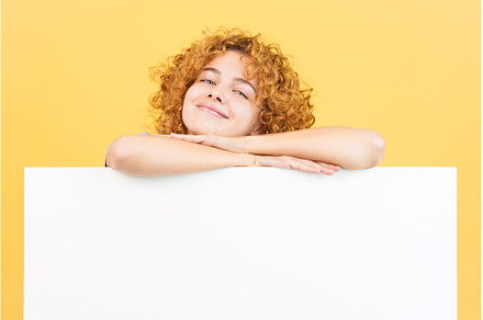 Relaxed woman with curly hair, a Person Photo by Iván Moreno STOCK PHOTO
