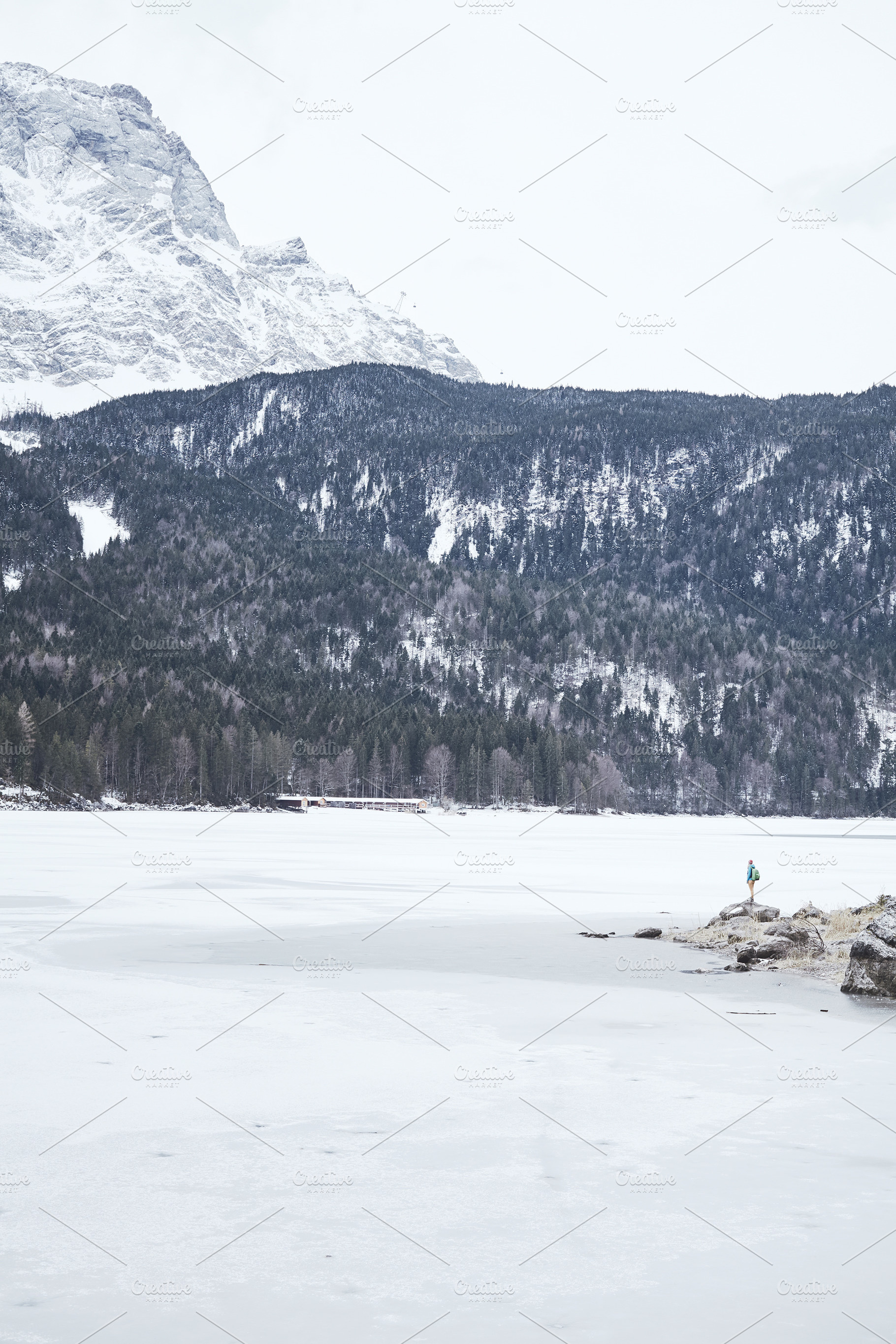 Tourist at winter mountain lake featuring active, activity, and adventure, a Nature Photo by Sergey Furtaev