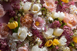 Spring flower wall with a mix of pink, yellow, and white tulips, a Photo by Studio ANNA