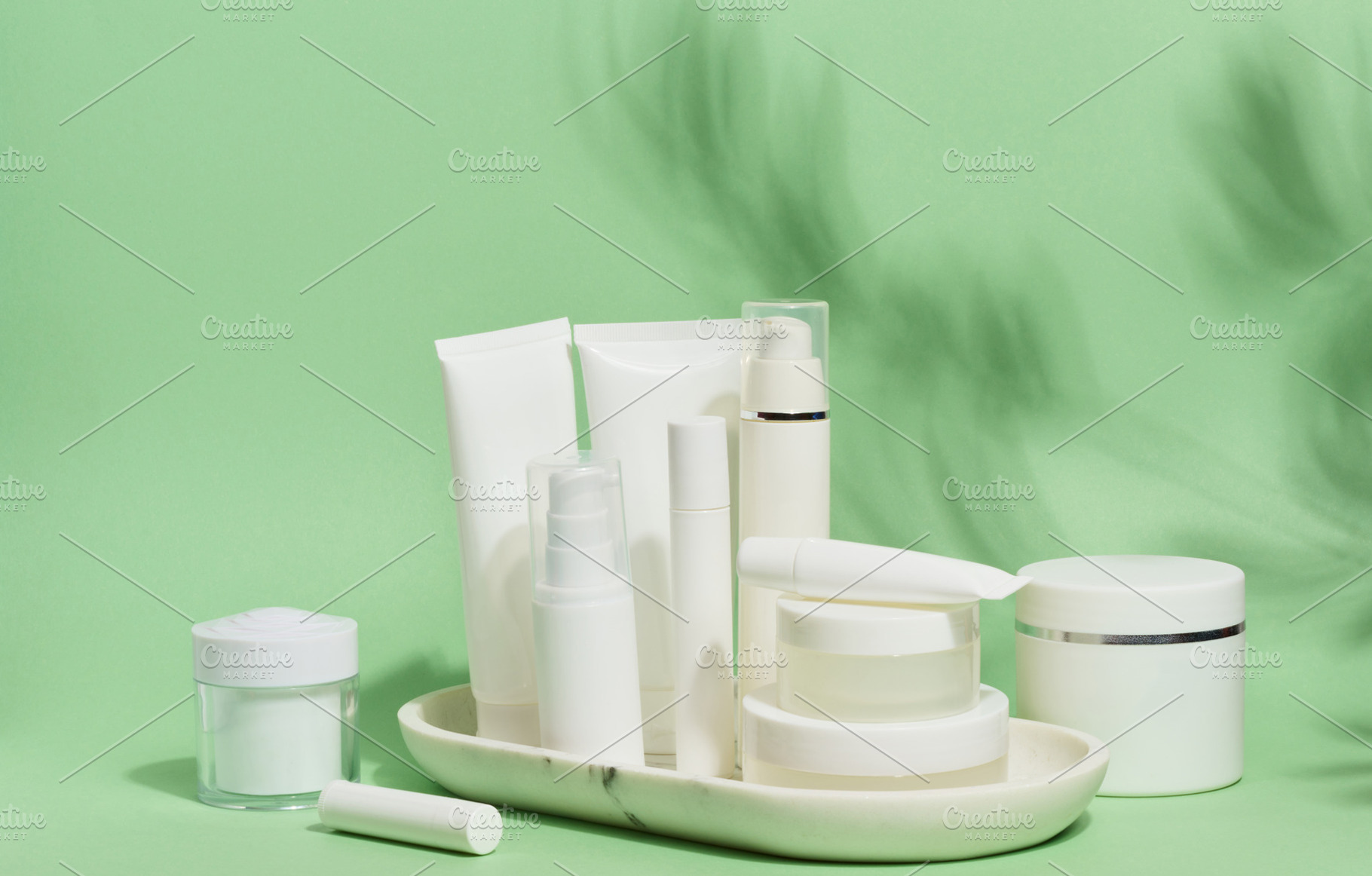 A collection of various white cosmetic containers, including tub, a Health & Medical Photo by ndanko