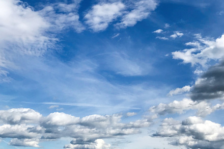 Beautiful countryside landscape with expansive blue sky and clouds, a Photo by AS photostudio