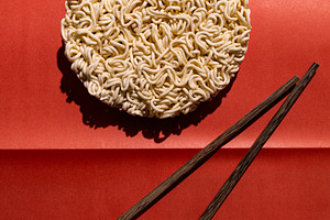 Round block of instant noodles, a Food & Drink Photo by Edalin's Store