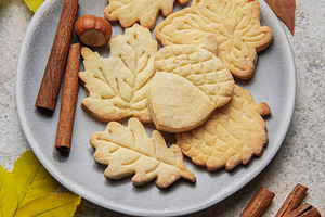 Autumn cookies on plate with cinnamon and hazelnuts, a Food & Drink Photo by Olena Rudo