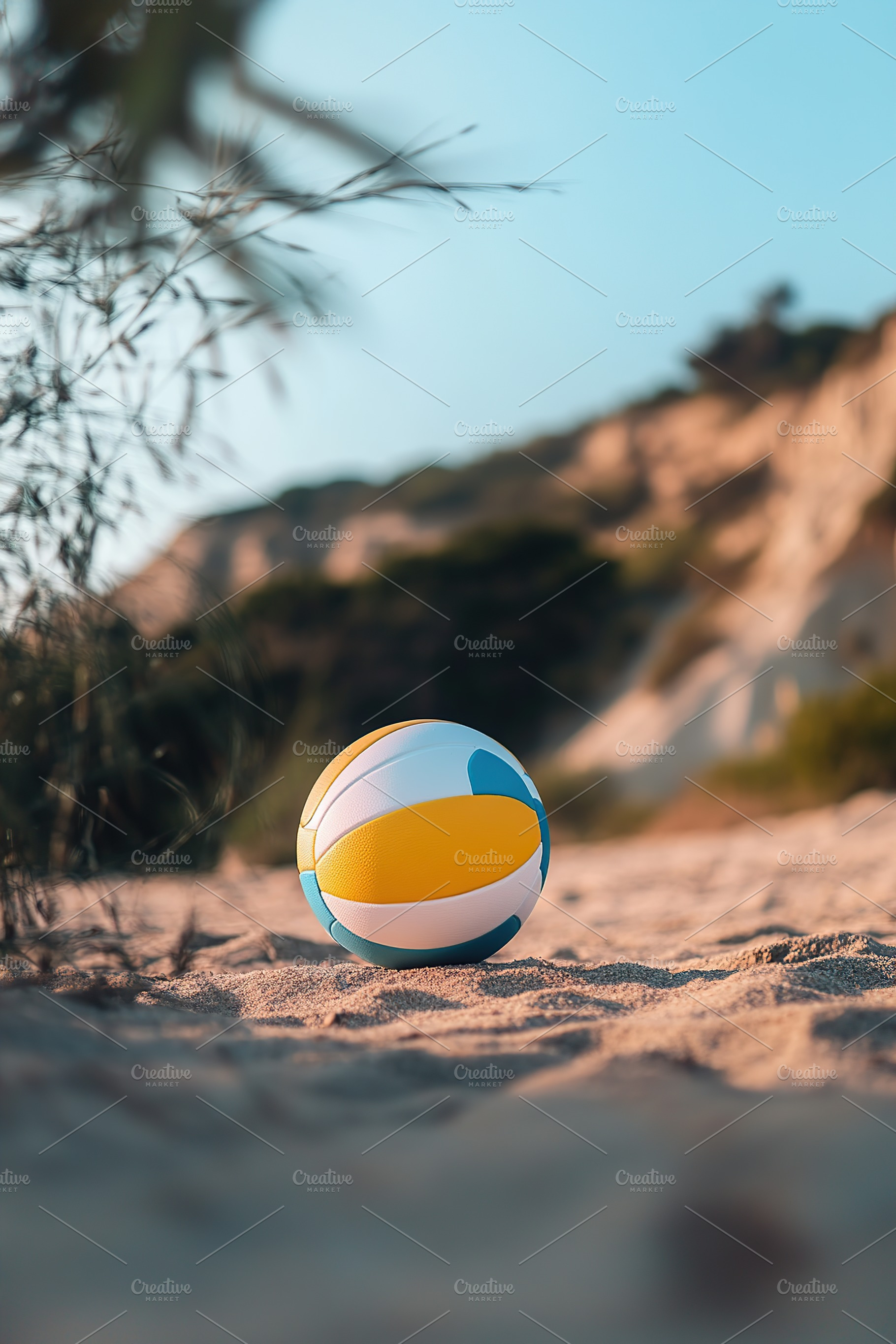 A bright volleyball sits on the soft, golden sand at a beach with a clear blue, a Sports & Recreation Photo by AlyaAnd