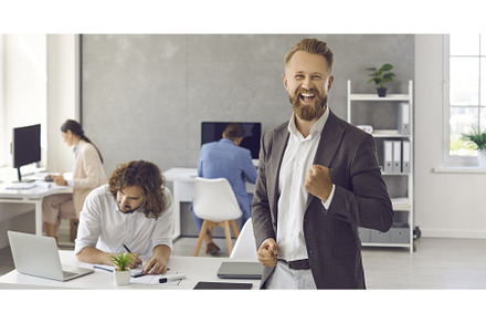 Businessman standing in office and, a Person Photo by StudioRomantic