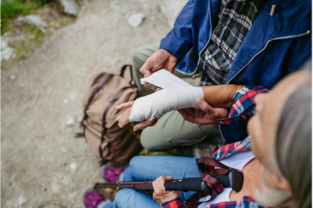 Senior woman injured her arm during, a Nature Photo by HalfPoint