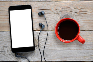 Smartphone and coffee cup, a Technology Photo by Anatoliy Sadovskiy