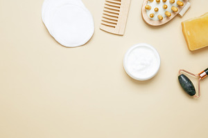 Natural beauty set with marble roller, gua sha, wooden body brush, face cream a, a Photo by matucha