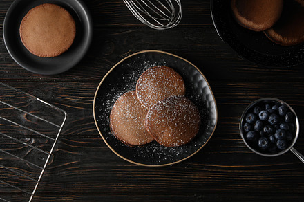 Concept of sweet food, chocolate pancakes, top view, a Food & Drink Photo by AtlasStudio PRO
