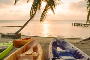 Beach Sunrise With Kayaks, a Sports & Recreation Photo by THP Creative