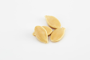 Pumpkin seeds on the white