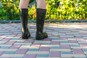 Person in Rubber Boots Outdoors, a Nature Photo by Ales Munt