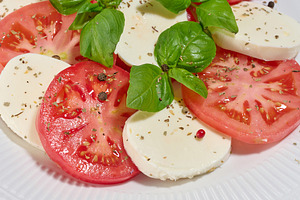 Classic Caprese salad with tomato slices, mozzarella and basil l, a Food & Drink Photo by ndanko