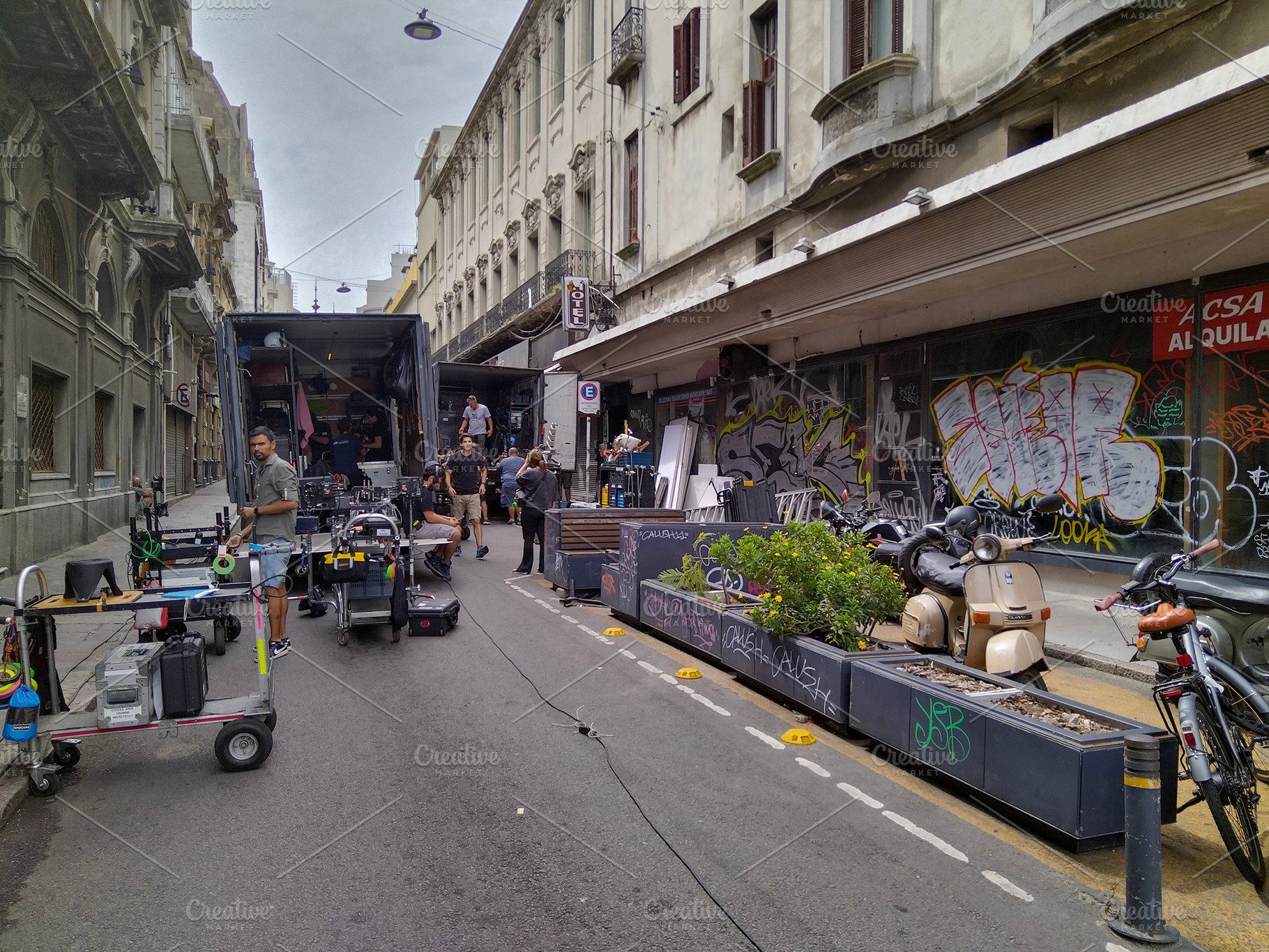 Film crew on location in pedestrian street with old buildings, an Architecture Photo by DanFLCreativo