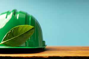 ESG and Clean Energy Concept. Hard Hat with a Green Leaf. Produc, a Photo by salmon.black