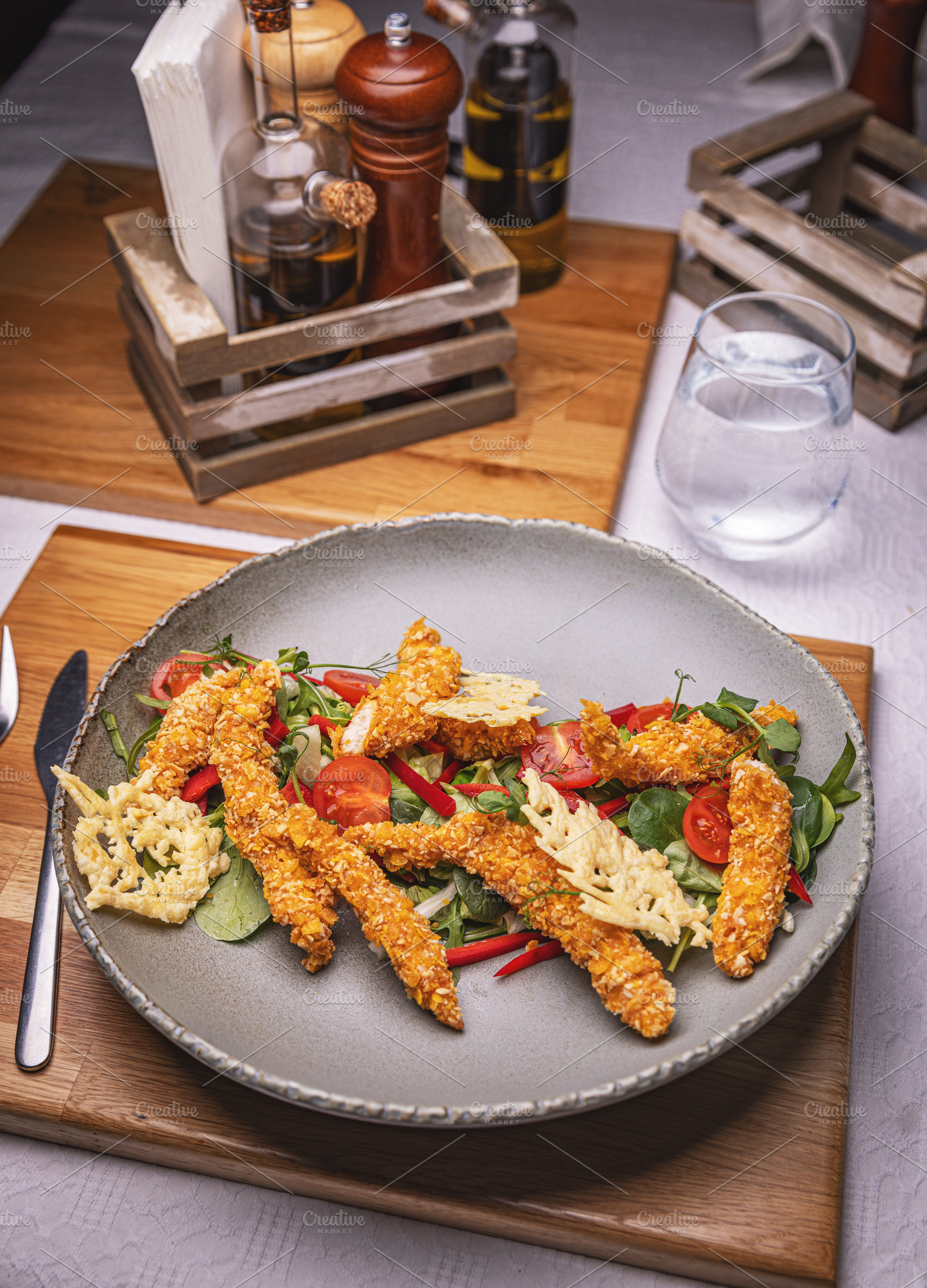Delicious breaded chicken strips, a Photo by Grafvision photography