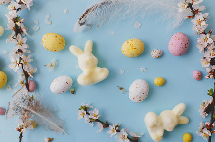Happy Easter! Colorful Easter chocolate eggs, bunny, cherry blos, a Holiday Photo by Sonjachni