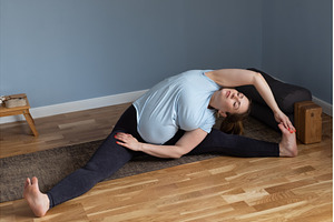 woman doing yoga Wide-Angle Seated