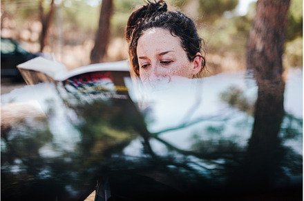 Young woman reading a book in a park, a Holiday Photo by Manu Reyes