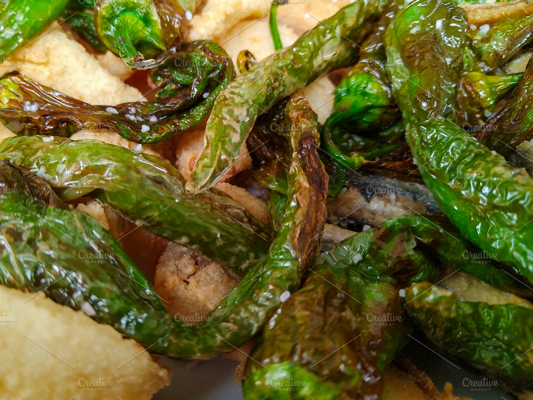 Fried padron peppers on rustic bread, a Food & Drink Photo by DanFLCreativo