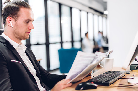 Handsome businessman relaxing use technology of desktop computer, a Person Photo by Art_Photo
