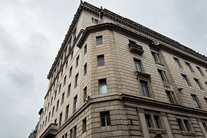 Historic stone office building corner with classical Beaux Arts
