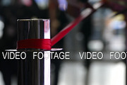 Ceremonial red ribbon cutting. Scissors in hands., a Background Graphic by KAA (Thumbnail 1 of 2)