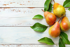 Red pears with leafs and copyspace for text on wooden table, a Food & Drink Photo by AlyaAnd