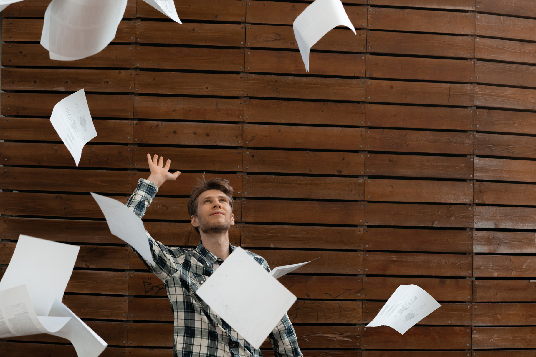 young stressed man throw crumpled pa, a Background Photo by Mikee's stuff