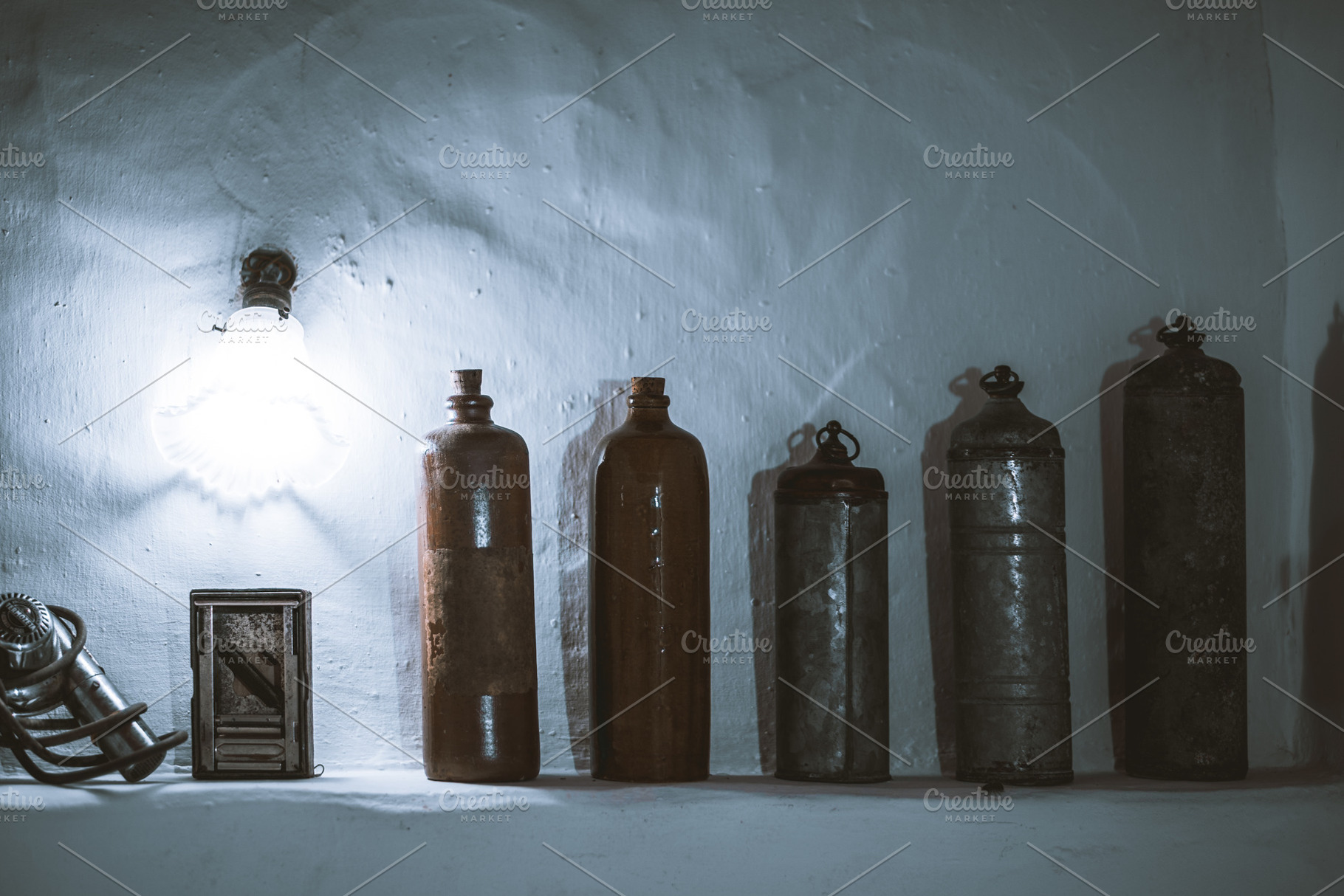 Vintage canisters under moody light, a Photo by SkyNext