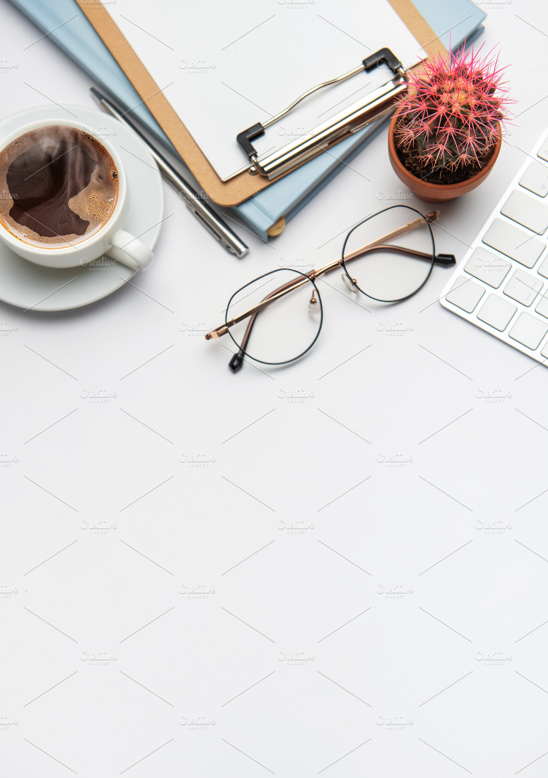 Office desk with coffee, clipboard, glasses, pen, keyboard and c, a Business Photo by Olena Rudo