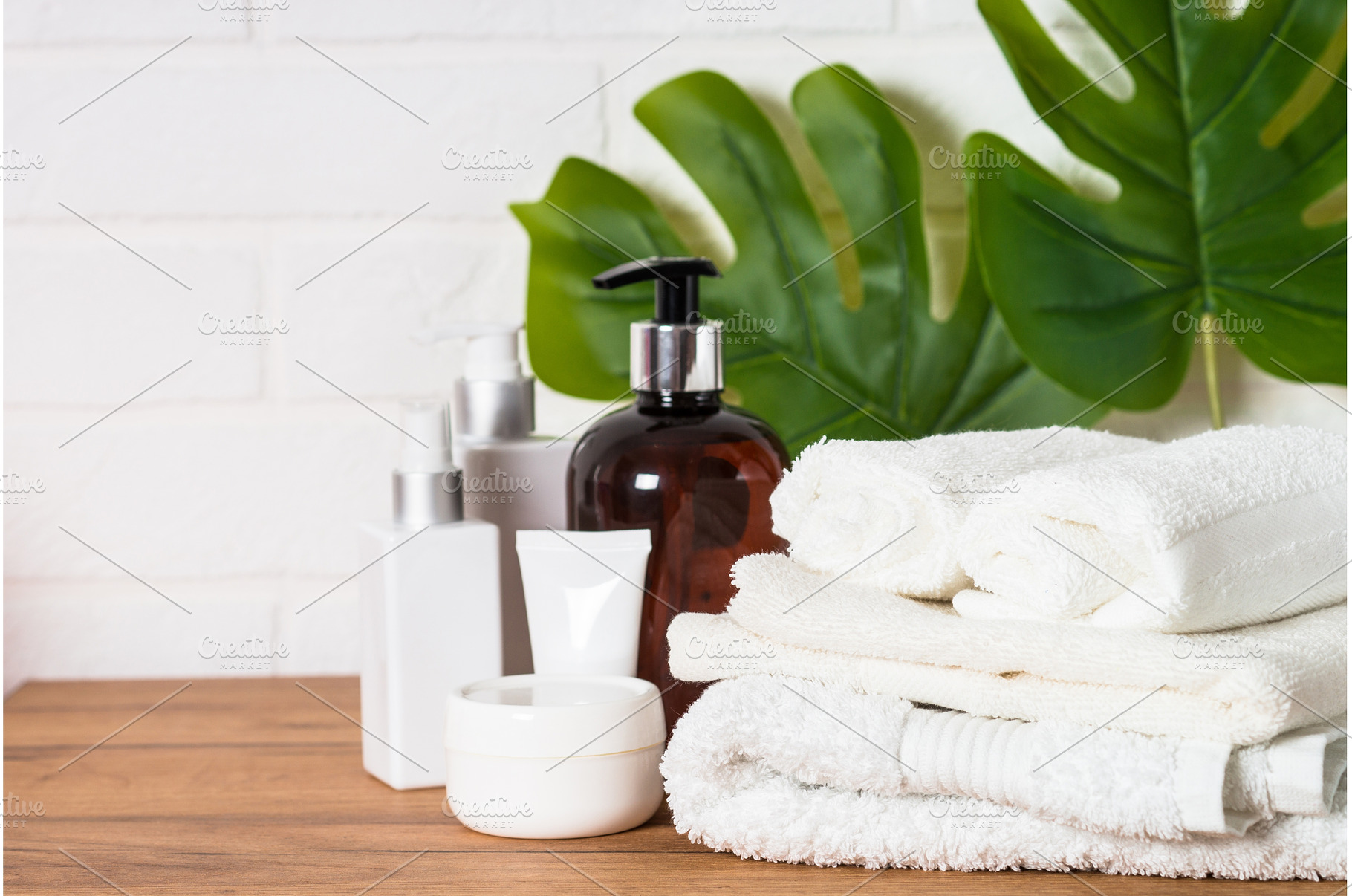 Bottle of soap and stack of towels, a Health & Medical Photo by Nadia-nb
