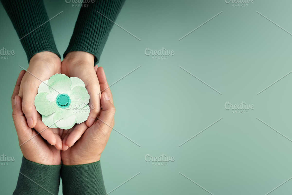 Two People  using Hands to Embracing a White Paper Poppy Flower, a Photo by salmon.black (Photo 2 of 3)