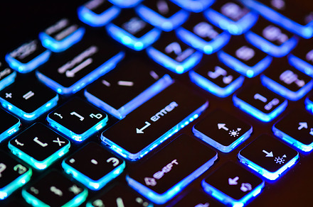 Laptop keyboard with backlight featuring red, abstract, and information, a Technology Photo by Sisika