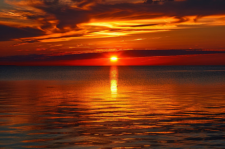 A breathtaking sunset captivates wit, a Photo by Tanuart