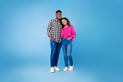 Full length of happy young African American couple in casual wear hugging and l, a Photo by Prostock-Studio (Thumbnail 2 of 2)