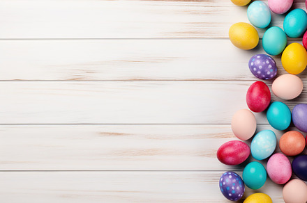 Colorful easter eggs on wooden background, a Holiday Photo by AlyaAnd