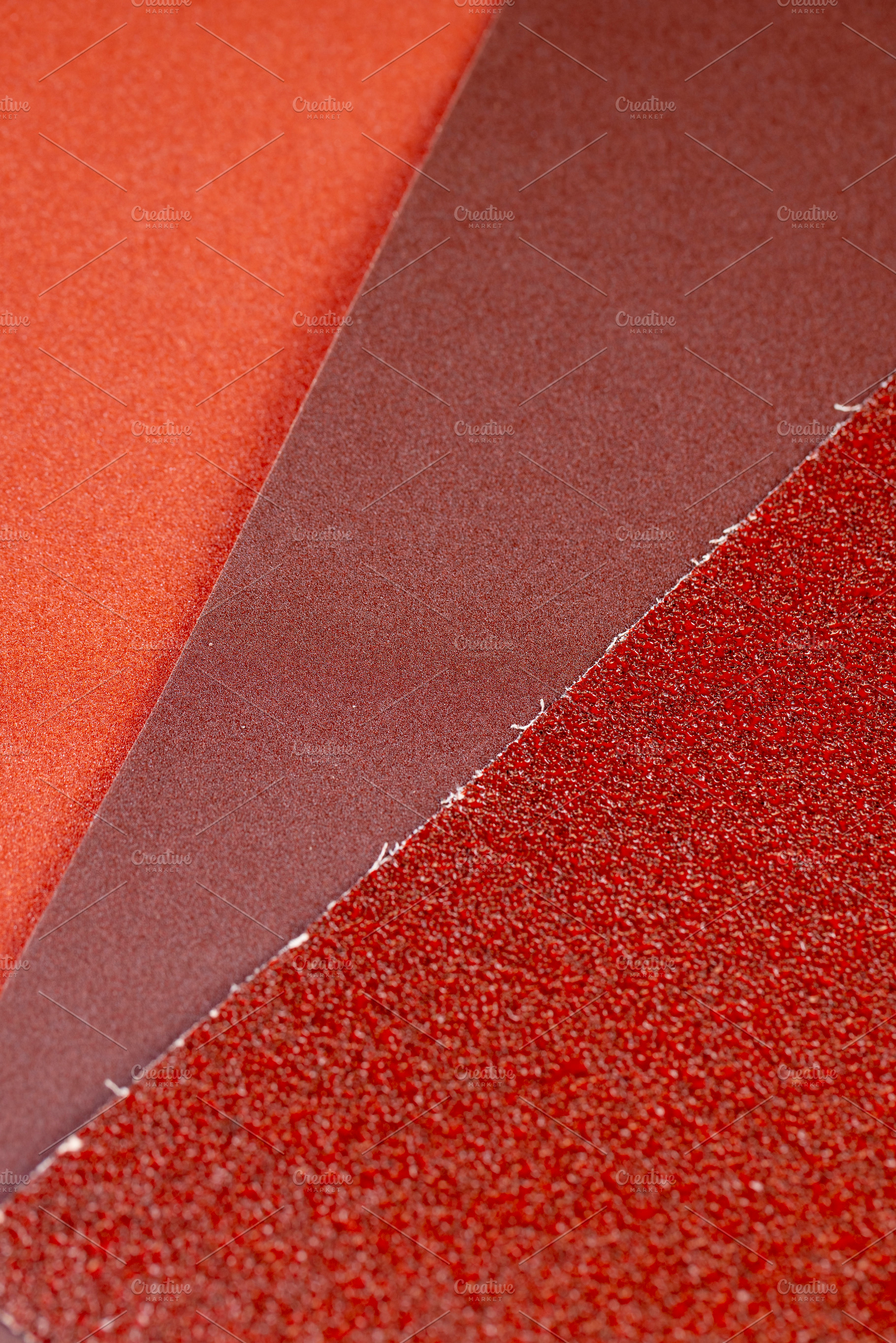several different sheets of sandpaper for metal or wood processing, a Photo by rsoollAI